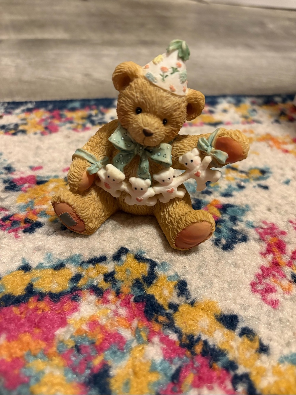 Cherished Teddies figurine named “Unfolding Happy Wishes Four You”